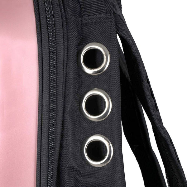 Pet Hardshell Traveling Backpack (pink), showcasing grommeted ventilation holes.