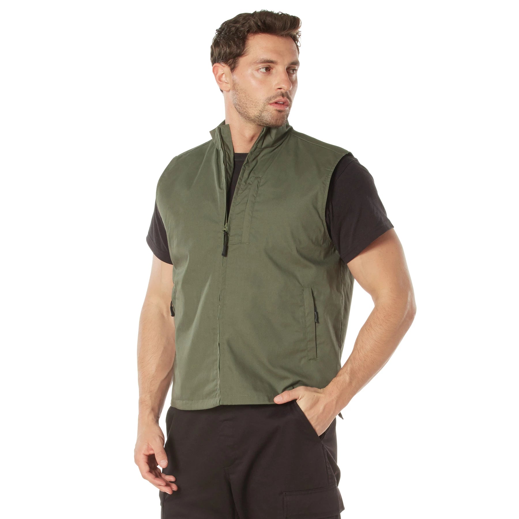 Man wearing a green vest over a black shirt on a white background