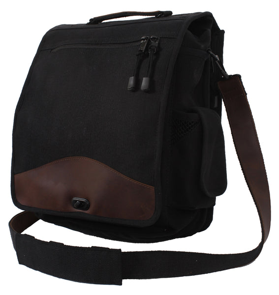 Rothco's Vintage M-51 Engineer's / Birdwatching Bag (Black), oblique front view in the closed configuration showing top handle, detachable shoulder sling, main weather flap with zippered compartment and brass closure, side pockets and leather accents.