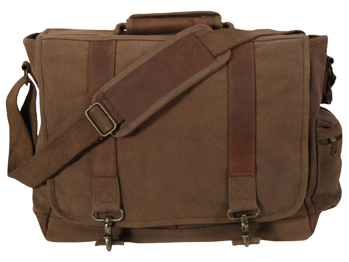 Rothco's Vintage Canvas Pathfinder Laptop Bag (Earth), front view in the closed configuration showing top carry handle, shoulder strap, side zippered pocket, weather flap with antique brass closures and leather accents.