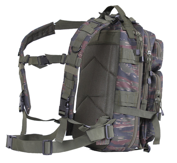 Rothco's Medium Transport Tactical Backpack (Tiger Stripes), side view showing padded shoulder straps, lifting handle, side-release chest and waist straps, padded back with open-top accessory pouch, the layering of compartments, one of 2 depth expansion and securing straps and 4 of the 8 side utility MOLLE loops.