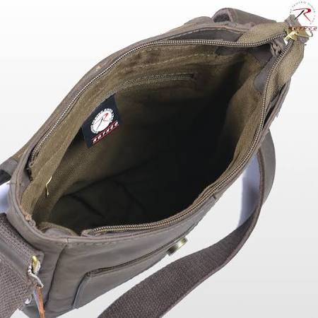 Rothco's Brown Leather Military Tech Bag, top view with weather flap open showing interior main compartment with zip closure, hidden interior zip pocket and shoulder sling.