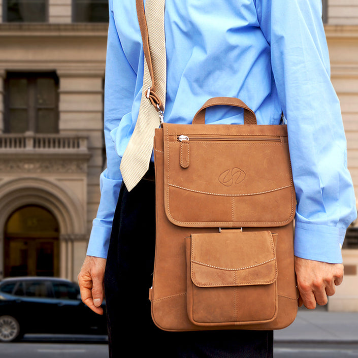 Premium Leather MacBook Messenger Bag (Vintage Brown), showing shoulder strap in use.
