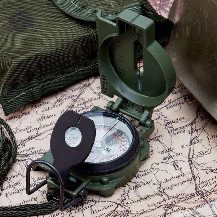 Cammenga 3H G.I. Military Tritium Lensatic Compass on a map with other equipment.
