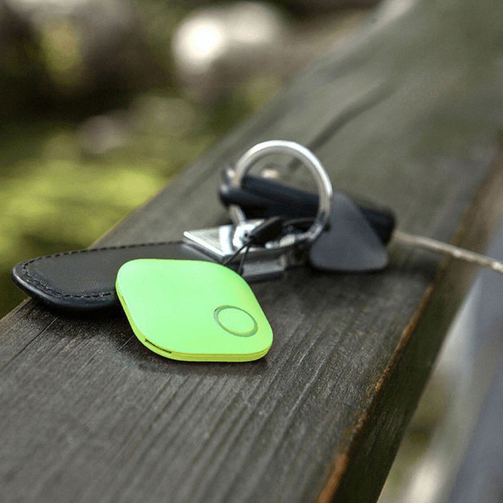 Anti-Lost Theft Device Alarm Bluetooth Remote GPS, shown attached to keys