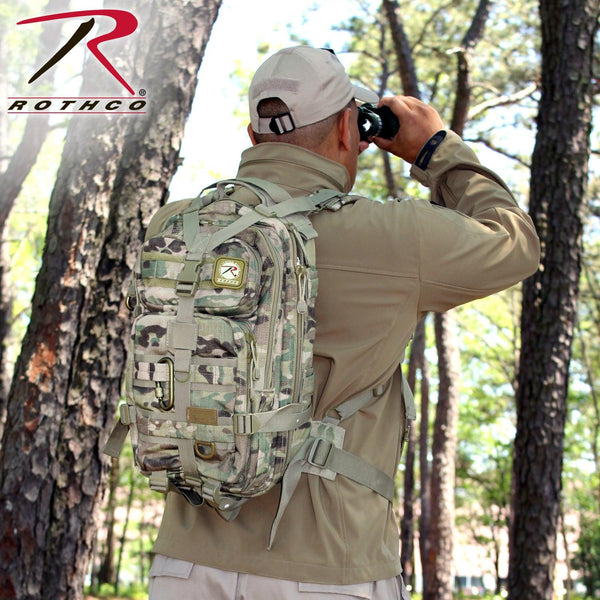 Rothco's Medium Transport Tactical Backpack (MultiCam), oblique view showing the shoulder and waist straps in use.