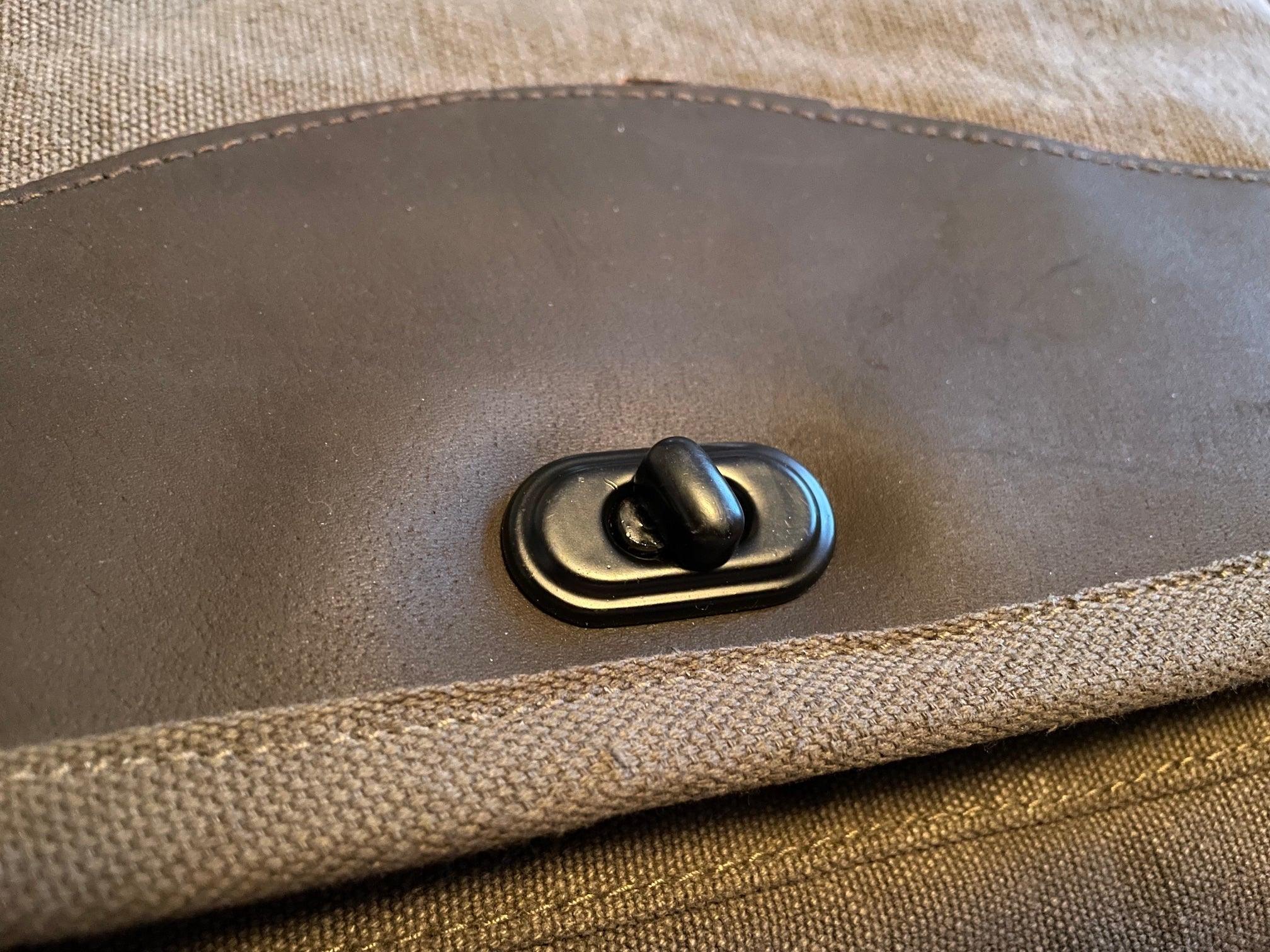 Rothco Vintage M-51 Engineer’s / Birdwatching Bag with Leather Accents, showing Front Metal Turning Lock and Leather Accent on the Main Weather Flap.