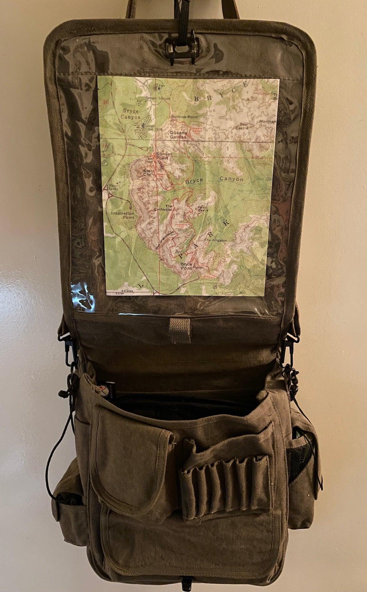 Rothco Vintage M-51 Engineer’s / Birdwatching Bag with Leather Accents, showing Map / Chart Viewing Pocket under the Main Weather Flap. Also shown are the font organizer pockets and the main compartment holding the Rothco Tactical Map Case Board (sold separately).