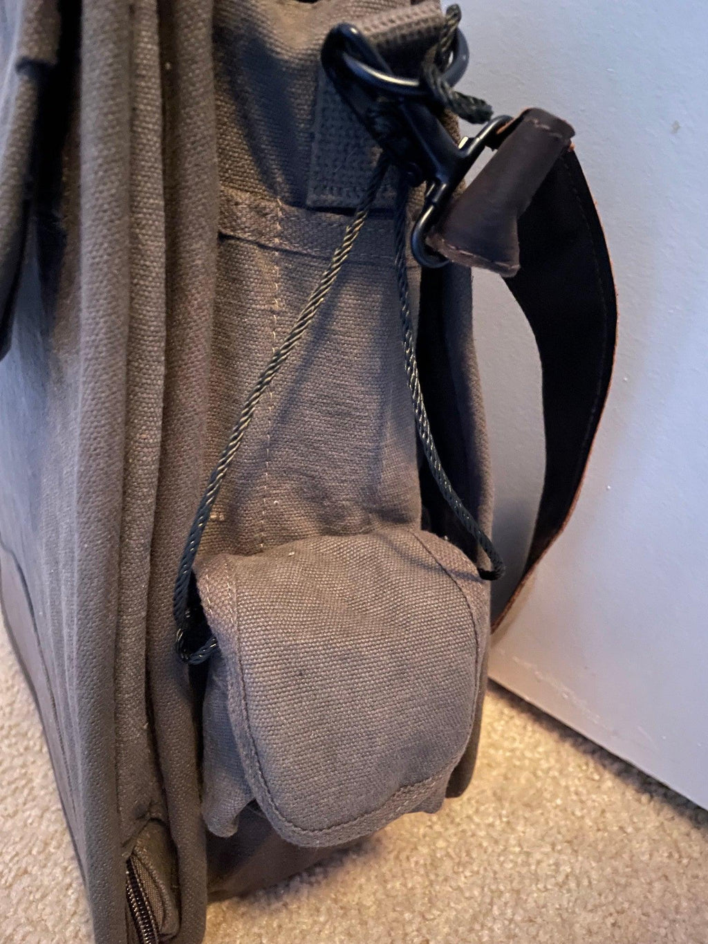 Rothco Vintage M-51 Engineer’s / Birdwatching Bag with Leather Accents, showing the Smaller of the two Hook and Loop Side Pockets and the 3 Open-Top Pockets for your most-used pens and markers (not included).