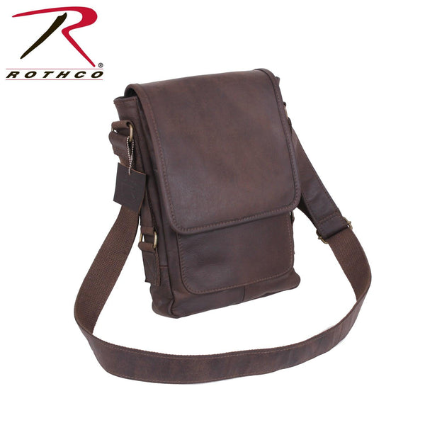 Rothco's Brown Leather Military Tech Bag, oblique front view showing shoulder sling and weather flap closed.